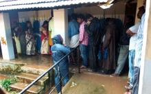 Voters turned up in rain coats on account copious rains in Thiruvananthapuram