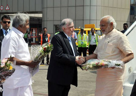 Prime Minister Narendra Modi being received at Karippur airport on Tuesday